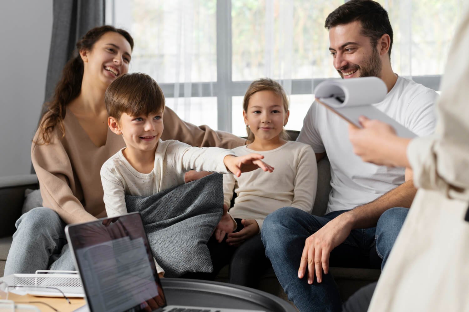 Joyful Family Therapy at Brampton A happy family during a therapy session in Brampton