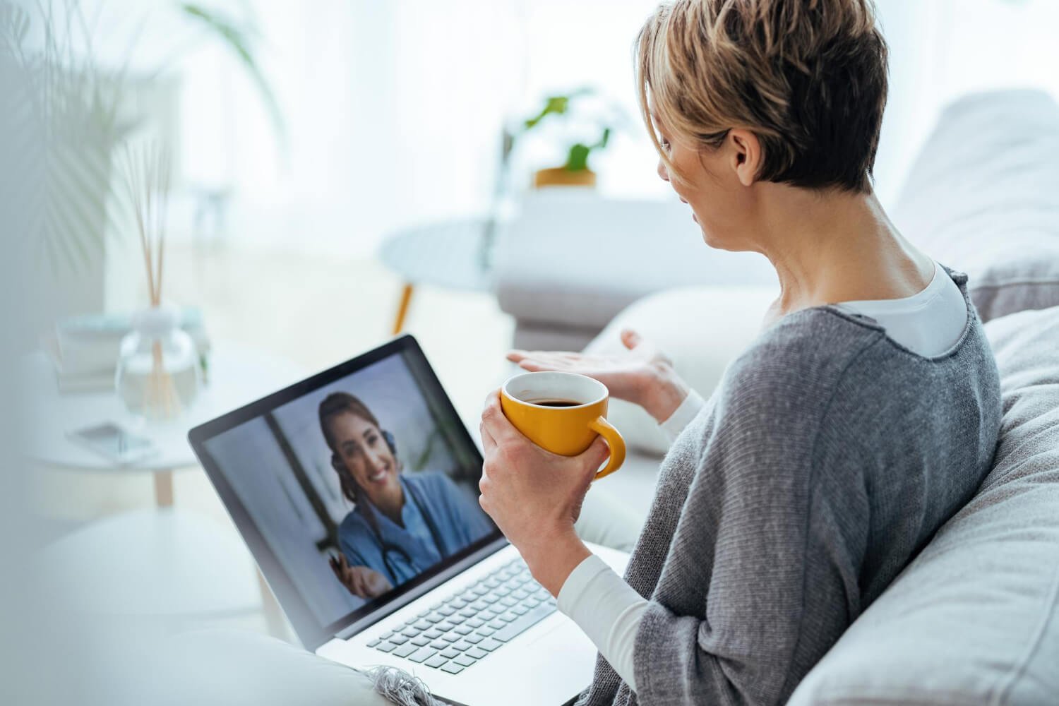 Online Therapy Convenience Woman having a therapy session through her laptop
