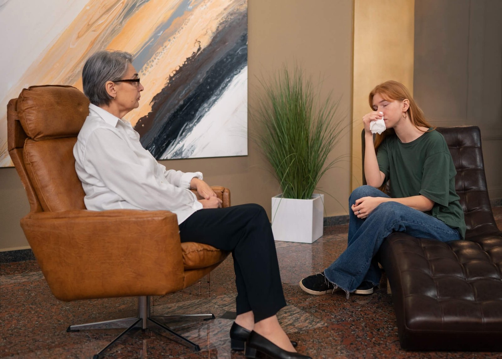 2150161931 Therapist helping a patient relax comfortably during a session